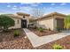 Tan house with a paved walkway leading to the front door at 644 San Raphael St, Kissimmee, FL 34759