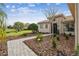 Landscaped front yard with a brick walkway leading to the house at 644 San Raphael St, Kissimmee, FL 34759