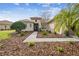 Landscaped front yard with a brick pathway to the entrance at 644 San Raphael St, Kissimmee, FL 34759