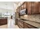Kitchen features stainless steel appliances and granite countertops at 644 San Raphael St, Kissimmee, FL 34759