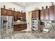 Modern kitchen with stainless steel appliances and ample wood cabinetry at 644 San Raphael St, Kissimmee, FL 34759