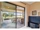 Private lanai with patio furniture and tranquil water view at 644 San Raphael St, Kissimmee, FL 34759