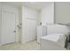 Bright laundry room with washer, dryer, and ample cabinet space at 644 San Raphael St, Kissimmee, FL 34759