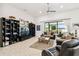 Living room with built-in shelving, large TV, and comfortable seating at 644 San Raphael St, Kissimmee, FL 34759