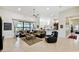 Open living room with neutral decor and views of the lake at 644 San Raphael St, Kissimmee, FL 34759