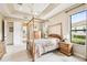 Spacious main bedroom with large windows and wood furniture at 644 San Raphael St, Kissimmee, FL 34759