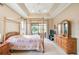 Main bedroom with canopy bed, dresser, and sliding doors to lanai at 644 San Raphael St, Kissimmee, FL 34759