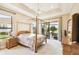 Main bedroom with four-poster bed and access to private bath at 644 San Raphael St, Kissimmee, FL 34759