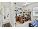 Home office with built-in shelving and comfortable seating at 644 San Raphael St, Kissimmee, FL 34759