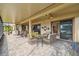Large screened patio, paver floor, wicker furniture, and access to inside at 644 San Raphael St, Kissimmee, FL 34759