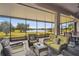 Relaxing screened patio with wicker seating and a coffee table and lake view at 644 San Raphael St, Kissimmee, FL 34759
