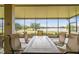 Spacious screened patio with lake view, comfortable seating, and dining area at 644 San Raphael St, Kissimmee, FL 34759