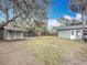 Backyard view showcasing a shed and a large grassy area at 645 King St, Eustis, FL 32726