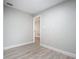 Simple bedroom with wood-look floors at 645 King St, Eustis, FL 32726
