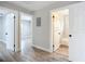 Hallway with doors to bedrooms and bathroom at 645 King St, Eustis, FL 32726