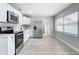 Modern kitchen with white cabinets and stainless steel appliances at 645 King St, Eustis, FL 32726