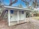 Well-maintained storage shed with a covered porch at 645 King St, Eustis, FL 32726