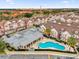Community pool and townhouses aerial view at 7591 Sunny Dreams Ln, Kissimmee, FL 34747