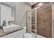Bathroom with a walk-in shower and granite vanity at 7591 Sunny Dreams Ln, Kissimmee, FL 34747