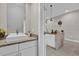 Clean bathroom with granite vanity and modern sink at 7591 Sunny Dreams Ln, Kissimmee, FL 34747