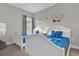 bedroom with two twin beds and Mickey Mouse decor at 7591 Sunny Dreams Ln, Kissimmee, FL 34747