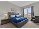 Spacious bedroom with large window and comfortable seating at 7591 Sunny Dreams Ln, Kissimmee, FL 34747