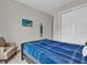 Bedroom with a queen bed and a comfortable chair at 7591 Sunny Dreams Ln, Kissimmee, FL 34747