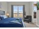 Bedroom with large window and en-suite bathroom at 7591 Sunny Dreams Ln, Kissimmee, FL 34747