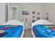 bedroom with two twin beds and Disney decor at 7591 Sunny Dreams Ln, Kissimmee, FL 34747
