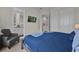 Bedroom with en-suite bathroom and comfortable chair at 7591 Sunny Dreams Ln, Kissimmee, FL 34747