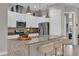 Modern kitchen with stainless steel appliances and granite countertops at 7591 Sunny Dreams Ln, Kissimmee, FL 34747