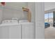 Bright laundry room with washer and dryer included at 7591 Sunny Dreams Ln, Kissimmee, FL 34747