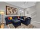Spacious living room with sectional sofa and large world map art at 7591 Sunny Dreams Ln, Kissimmee, FL 34747