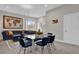 Open living space with sectional sofa, dining table, and world map art at 7591 Sunny Dreams Ln, Kissimmee, FL 34747