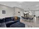 Open floor plan with living and dining areas and kitchen at 7591 Sunny Dreams Ln, Kissimmee, FL 34747