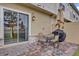 Private patio with table, chairs, and grill at 7591 Sunny Dreams Ln, Kissimmee, FL 34747