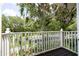 Private balcony overlooking lush landscaping and a road at 8407 Crystal Cove Cv, Kissimmee, FL 34747