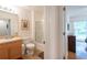 Clean bathroom with shower/tub combo and wood vanity at 8407 Crystal Cove Cv, Kissimmee, FL 34747