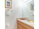 Clean bathroom with single sink vanity and mirror at 8407 Crystal Cove Cv, Kissimmee, FL 34747