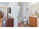 Bathroom with shower, toilet and wood vanity at 8407 Crystal Cove Cv, Kissimmee, FL 34747