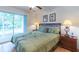 Bedroom with a queen bed and access to a balcony at 8407 Crystal Cove Cv, Kissimmee, FL 34747