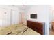 Main bedroom with dresser and en-suite bathroom at 8407 Crystal Cove Cv, Kissimmee, FL 34747