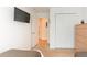 Bright bedroom with double bed, tv, and large closet at 8407 Crystal Cove Cv, Kissimmee, FL 34747