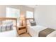 Two twin beds in a bright bedroom with wood furniture at 8407 Crystal Cove Cv, Kissimmee, FL 34747