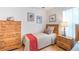 Bedroom with twin bed, dresser, and wood accents at 8407 Crystal Cove Cv, Kissimmee, FL 34747