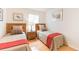 Two twin beds in a well-lit bedroom with wood accents at 8407 Crystal Cove Cv, Kissimmee, FL 34747