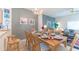 Dining area with table, chairs, and living room view at 8407 Crystal Cove Cv, Kissimmee, FL 34747