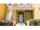House exterior with white door and landscaping at 8407 Crystal Cove Cv, Kissimmee, FL 34747