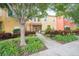 Front view of townhome with landscaping and walkway at 8407 Crystal Cove Cv, Kissimmee, FL 34747