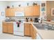 Kitchen with wood cabinets and modern appliances at 8407 Crystal Cove Cv, Kissimmee, FL 34747